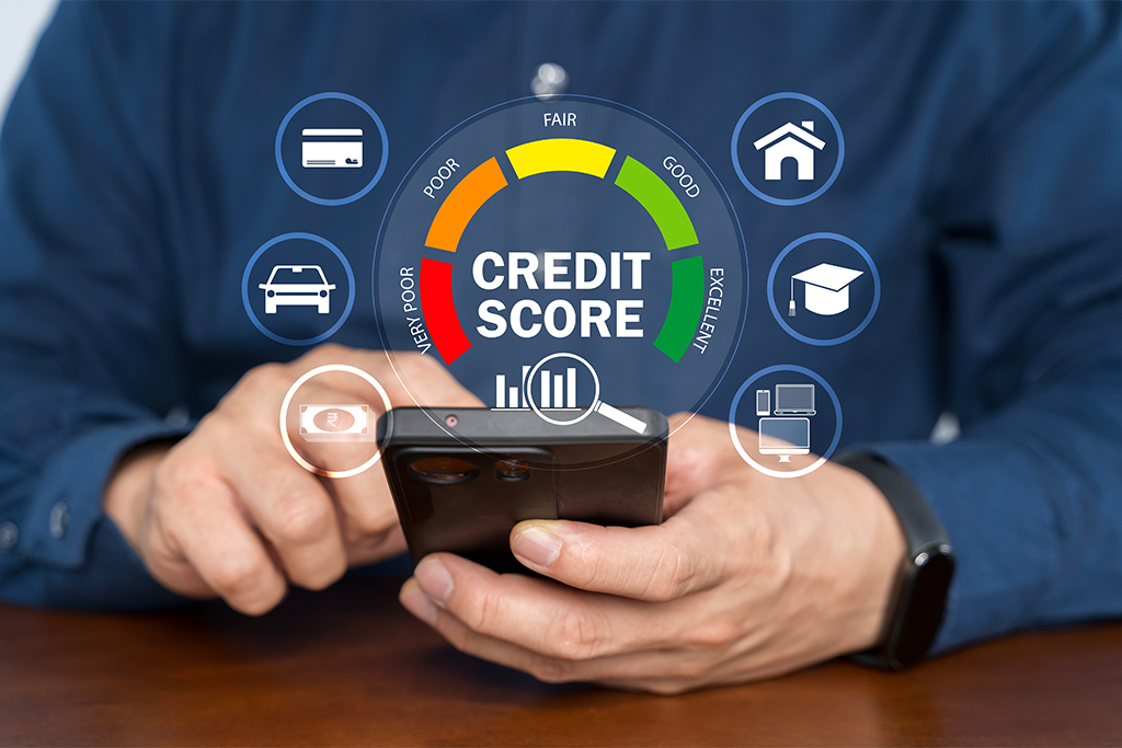 Factors That Drive Your Credit Score in 2025 ChatGPT said: Person checking credit score on phone with loan icons, showing financial tracking via FatakPay.