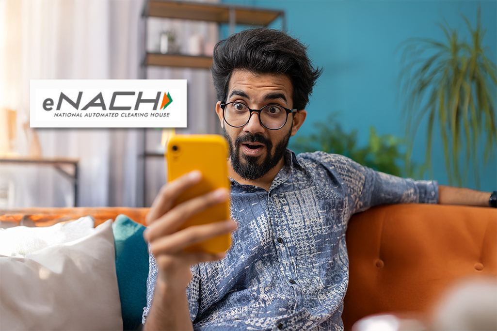 Surprised man learning about secure EMI auto-debit setup through eNACH on FatakPay app.