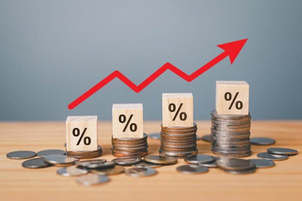 Coins and percent signs illustrating factors that impact personal loan interest rates.