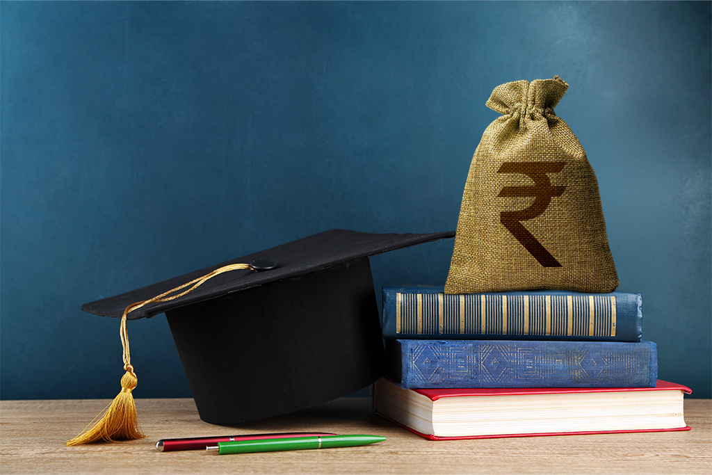 Graduation cap, books, and money bag showing instant education loan support from FatakPay.