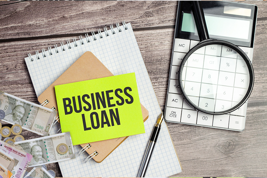 Instant personal loan funds for business startup with cash, notebook, and calculator on the desk.